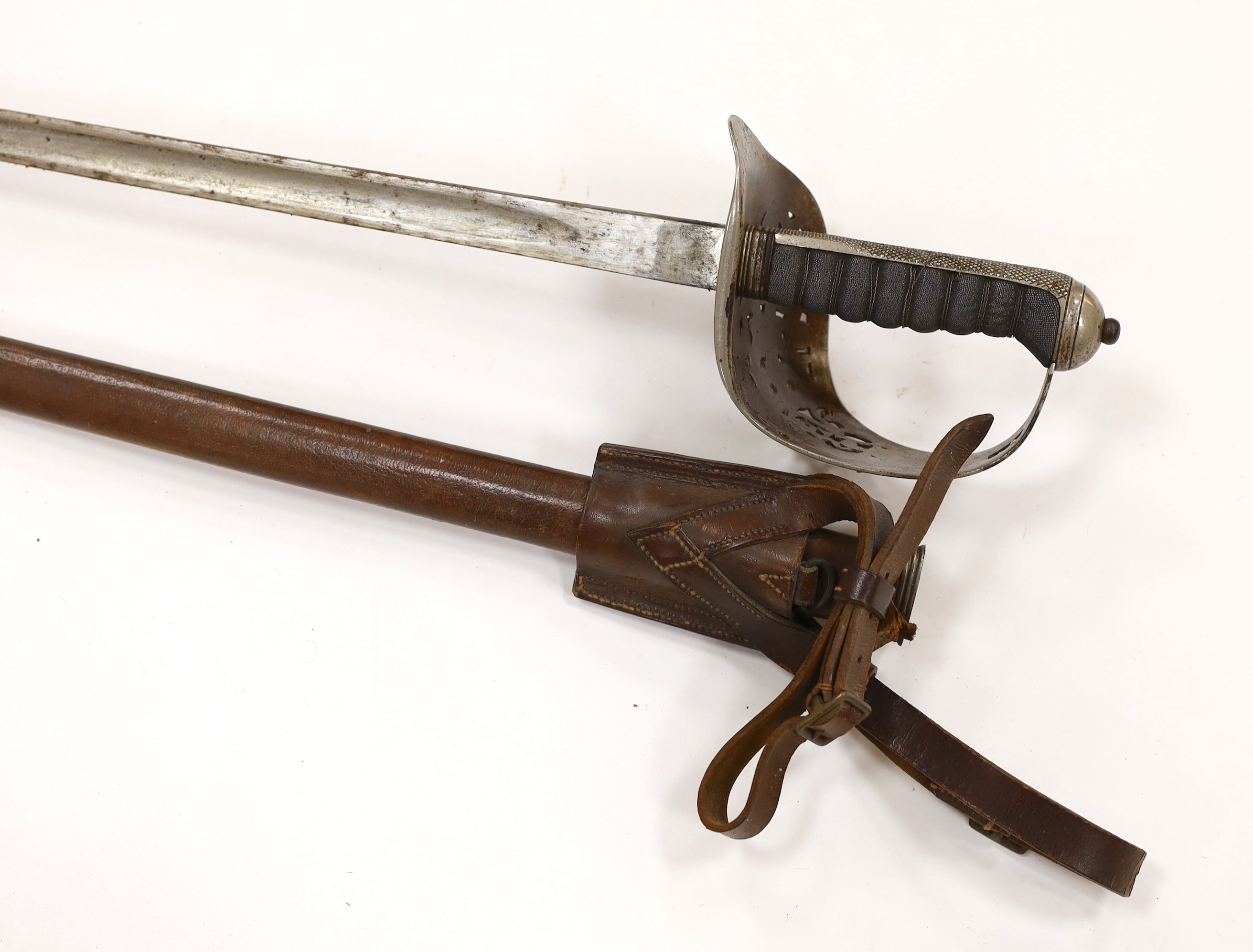 A George V 1897 pattern infantry officer's sword, with scabbard and leather hanger, blade 82cm